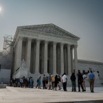 People line up outside of the Supreme Court in June 2023 in Washington, D.C.