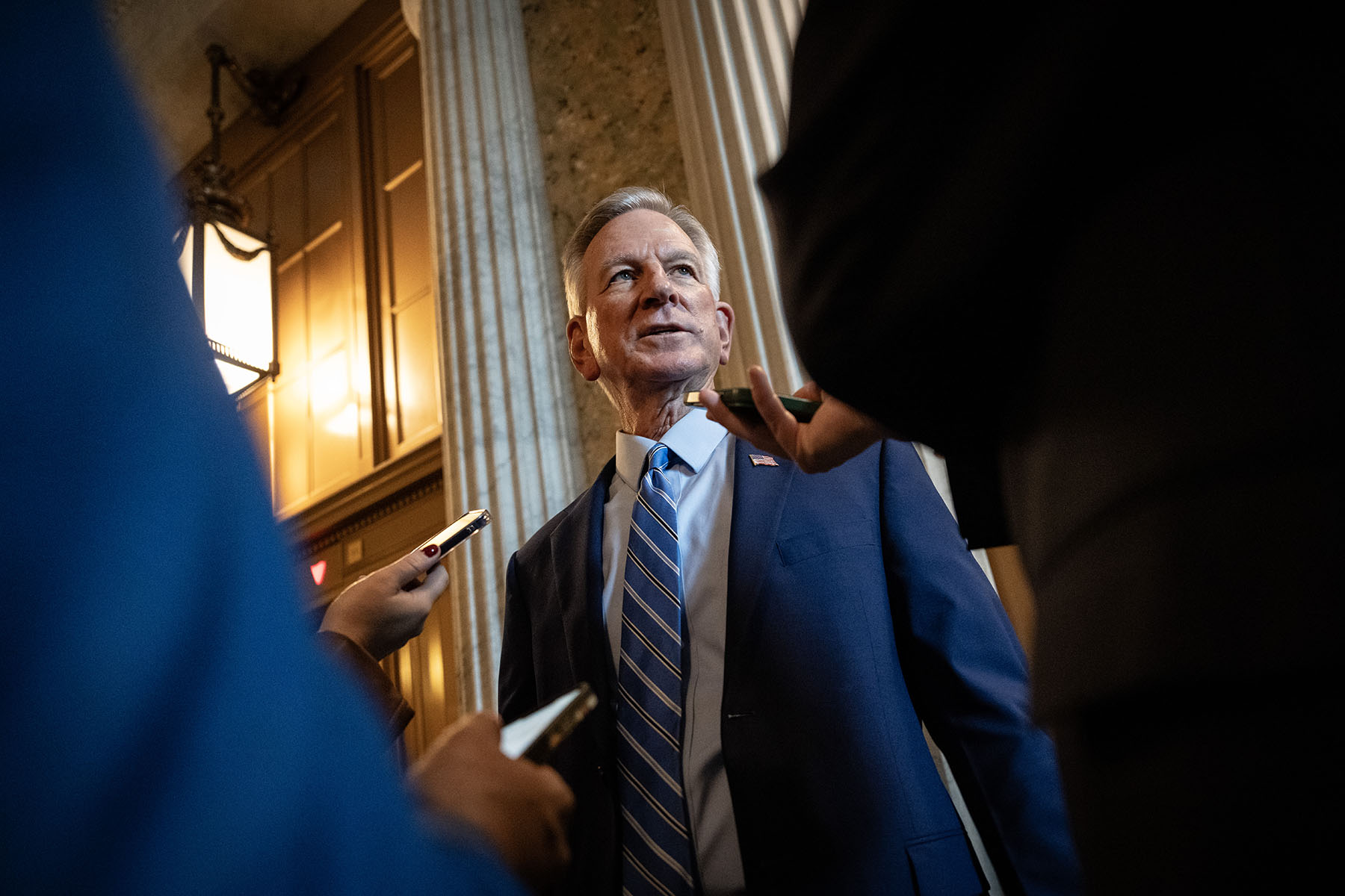 Sen. Tommy Tuberville speaks to reporters on his way to a closed-door lunch meeting with Senate Republicans.