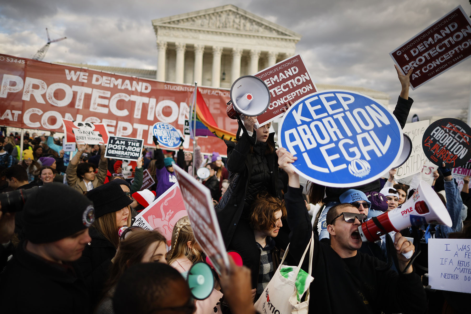 Abortion-rights supporters stage a counter protest in front of the Supreme Court during the 50th annual March for Life rally.