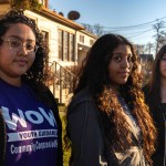 Counselor Yuli Paez-Naranjo poses with eighth graders Ana Ortiz and Deanna Palacio,