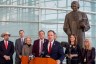 Rep. Matt Gress and other legislators hold a press conference in front of a statue of Justice Sandra Day O’Connor.