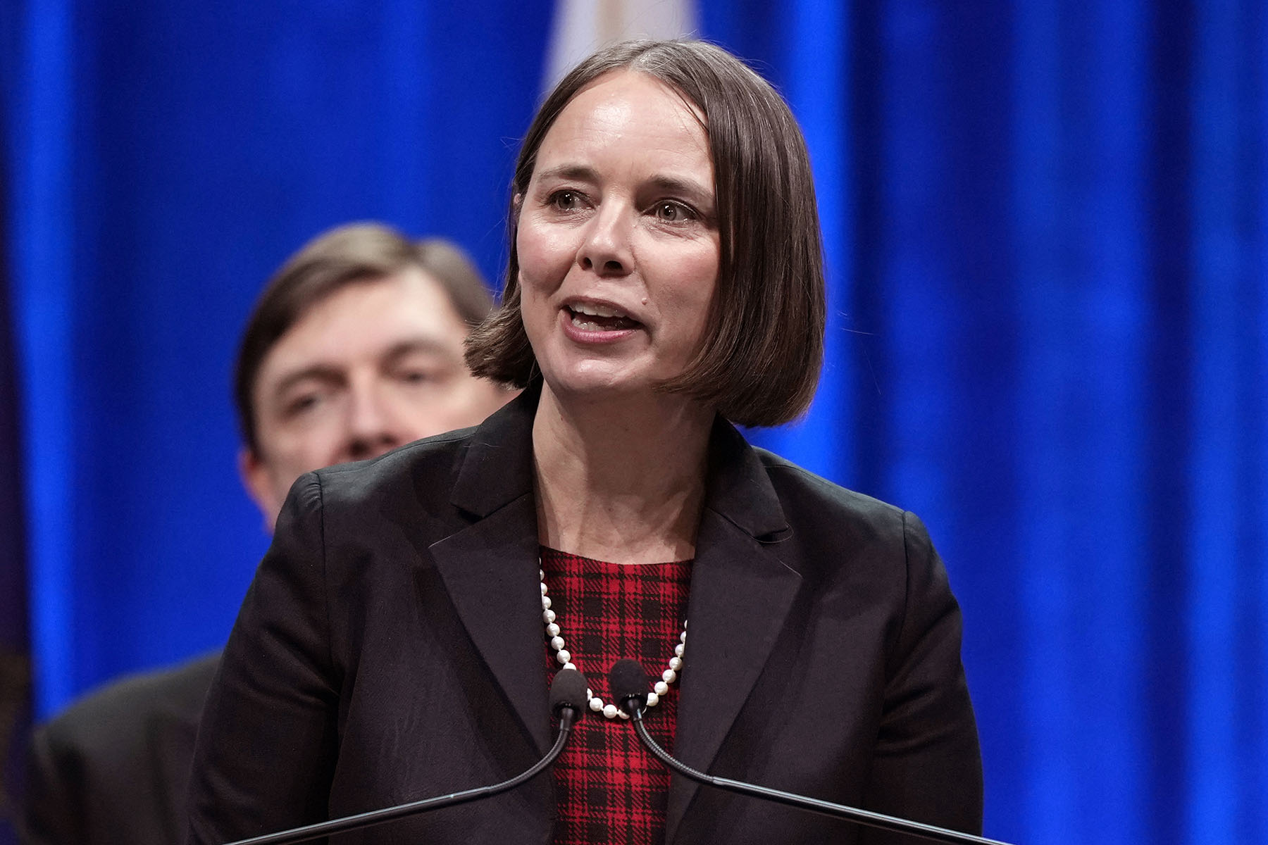 Maine Secretary of State Shenna Bellows speaks at a podium.