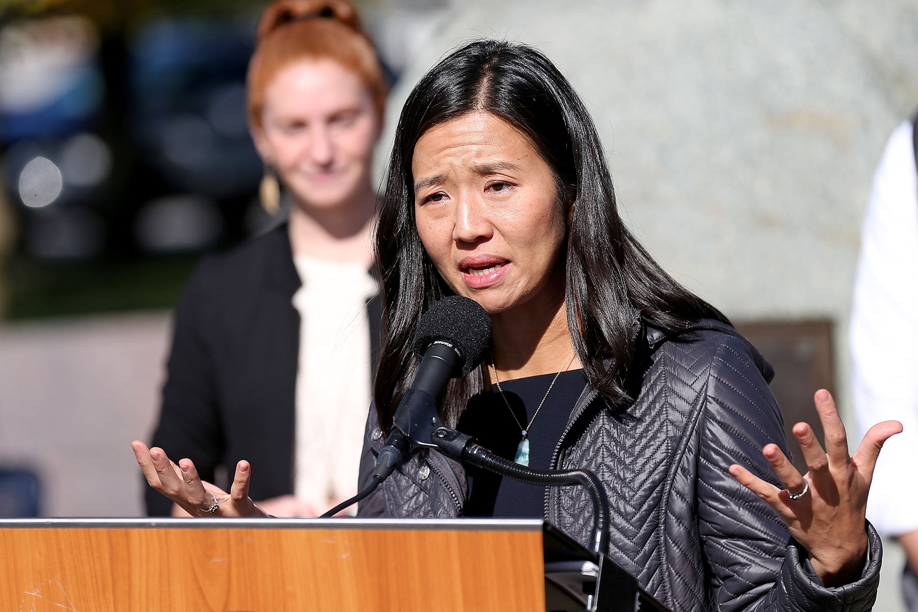 Boston Mayor Michelle Wu speaks at a podium.