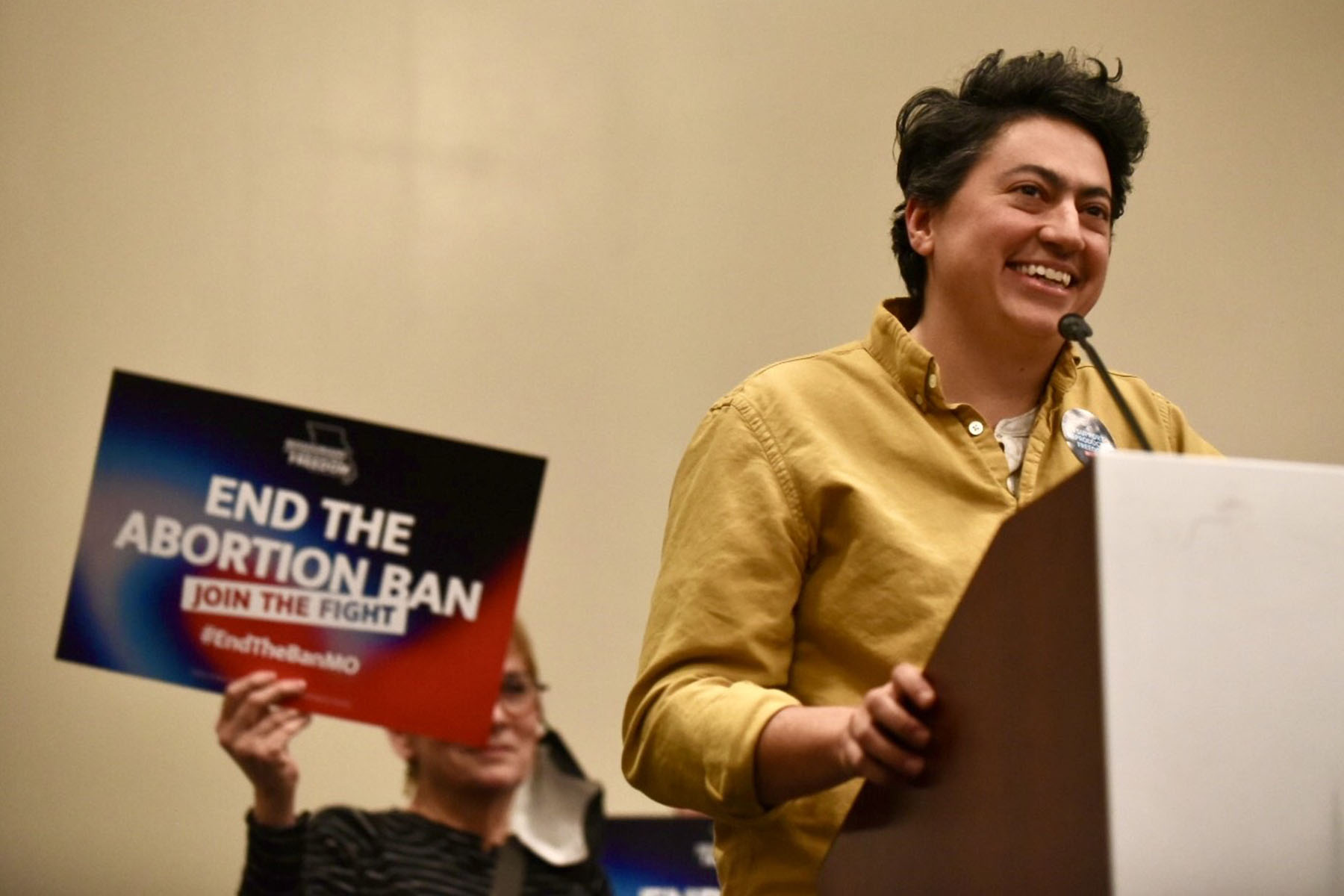 Iman Alsaden speaks at a podium during an event for Missourians for Constitutional Freedom.