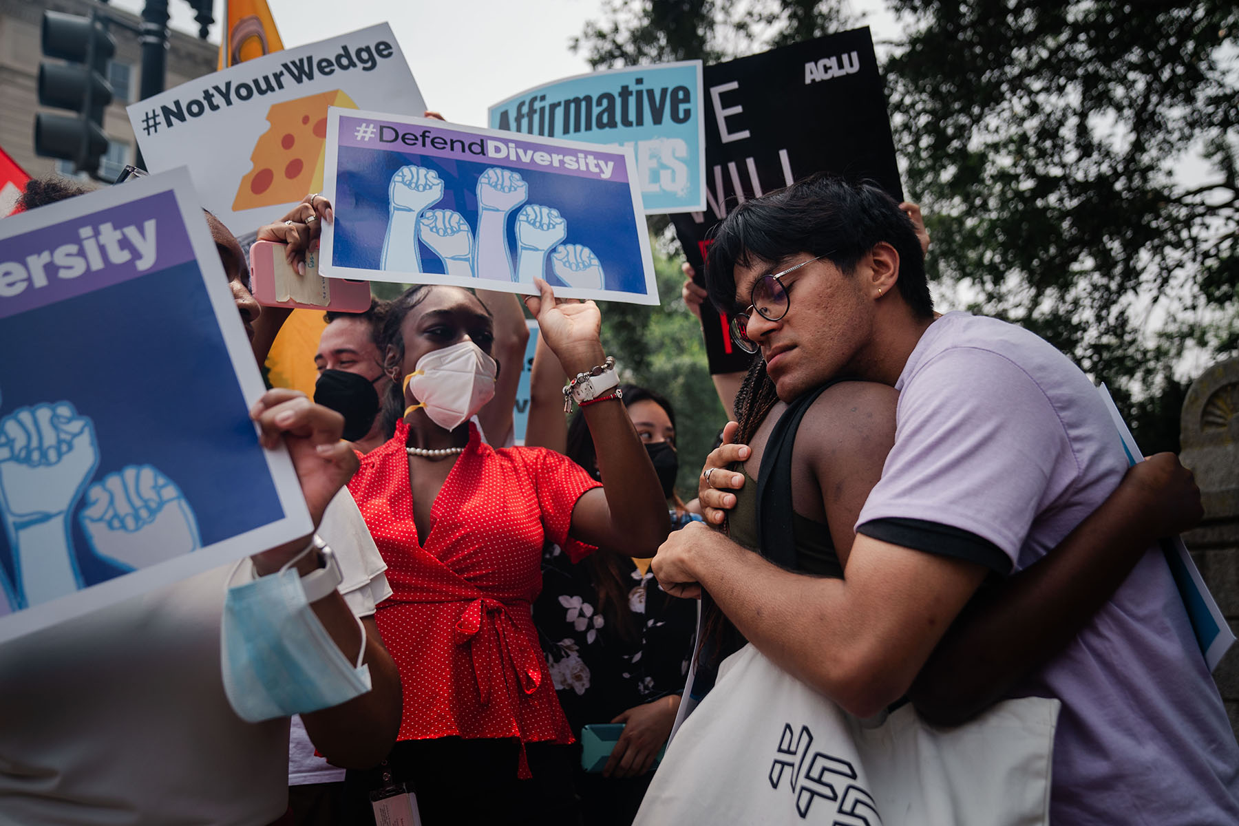 Students consoling one another outside the Supreme Court in Washington, D.C.