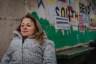 Emily Voorde sits for a portrait near a mural of South Bend, Indiana.