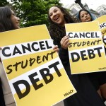 Student loan borrowers gather near The White House with signs.