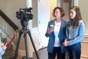 An image of Marilyn Lands speaking in front of a video camera with supporter Alyssa Gonzales.