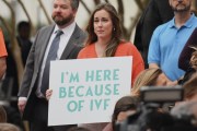 Sarah Brown, a Birmingham resident and in vitro fertilization patient, holds a sign at the Alabama Statehouse on Feb. 28, 2024