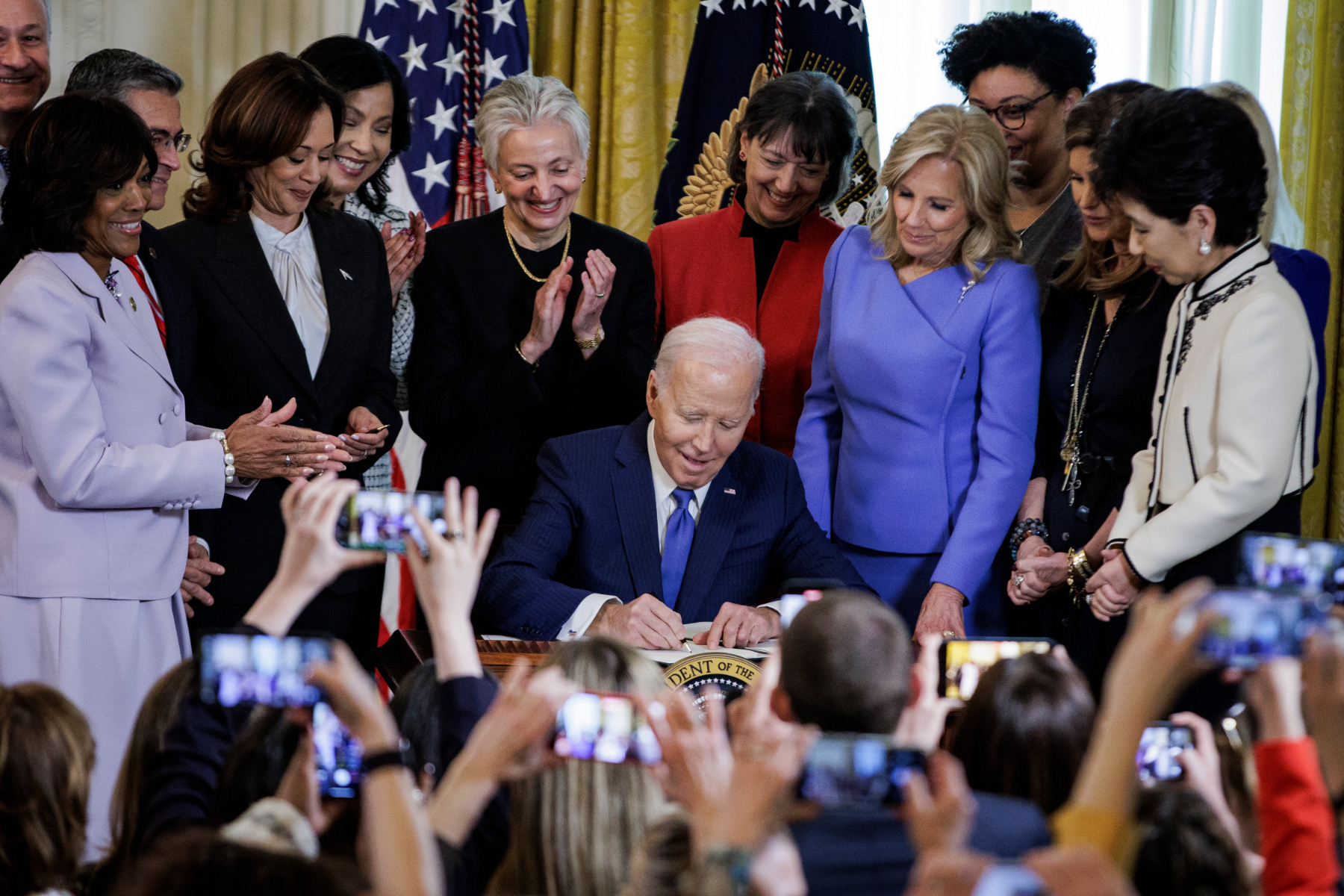 President Joe Biden signs an Executive Order about women's health.