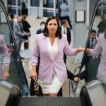 Katie Britt rides an escalator as she arrives at the Capitol.