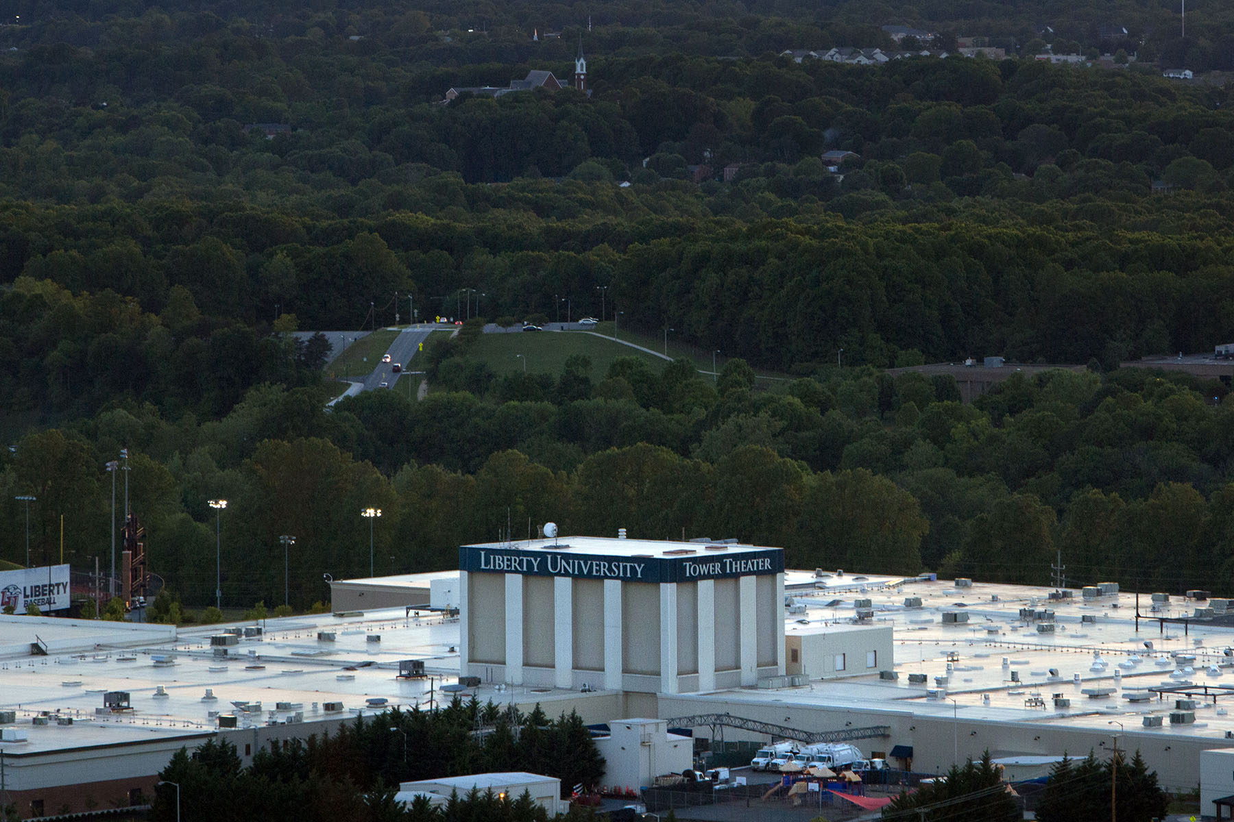 The sun sets over Liberty University's Tower Theater building