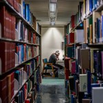 A person reads at the Rice University Library.