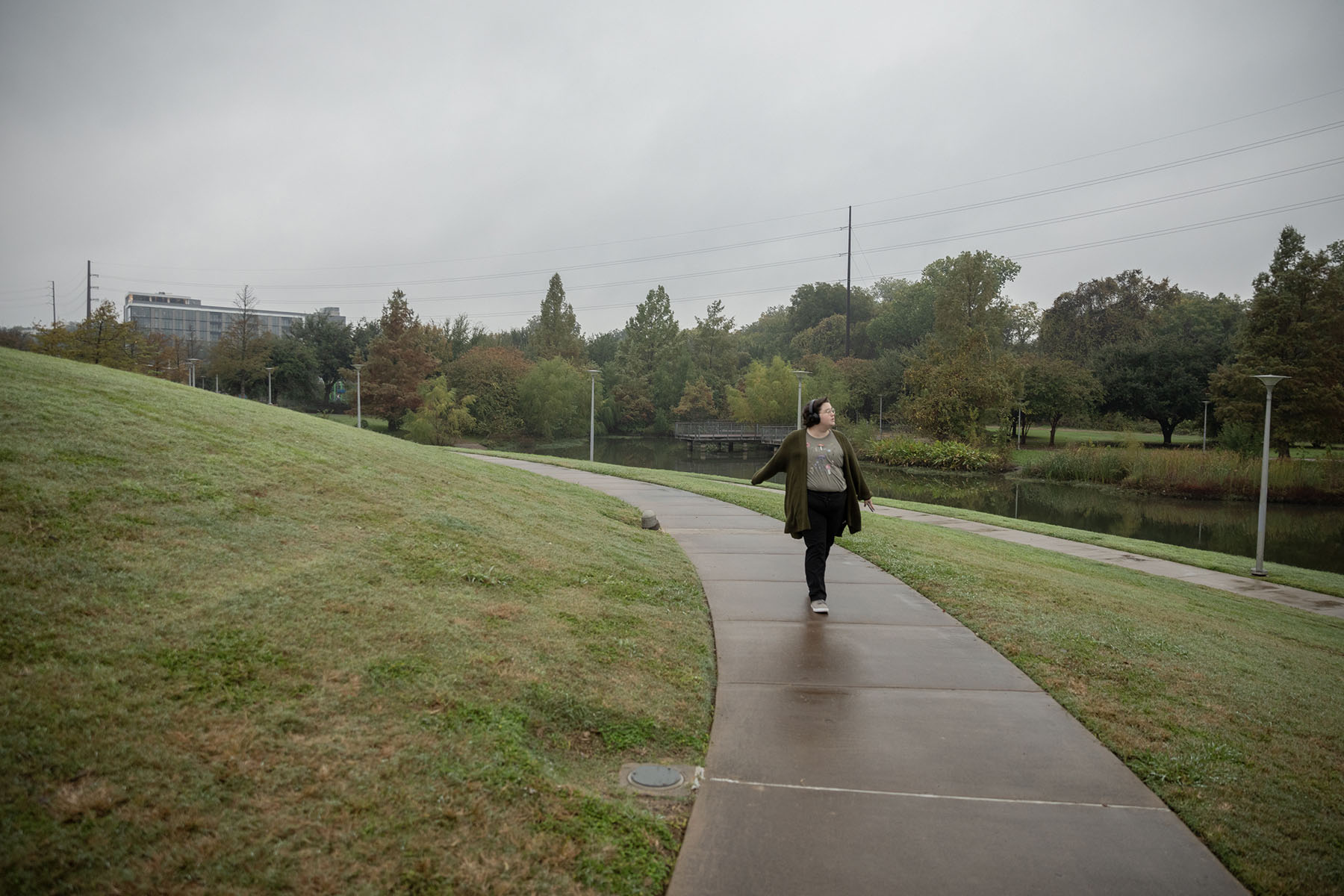 Asher walks in a park near downtown.