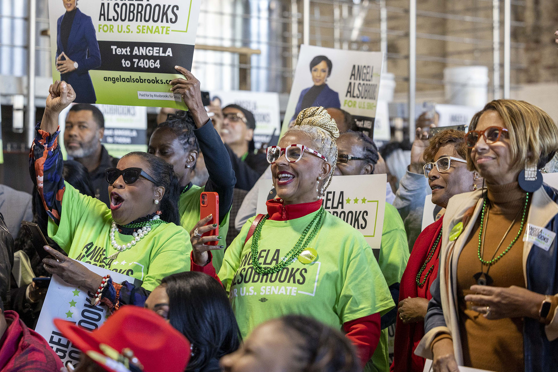 Supporters cheer for Angela Alsobrooks during a campaign event.