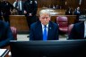 Former President Donald Trump arrives for his criminal trial with his legal team at Manhattan Criminal Court.