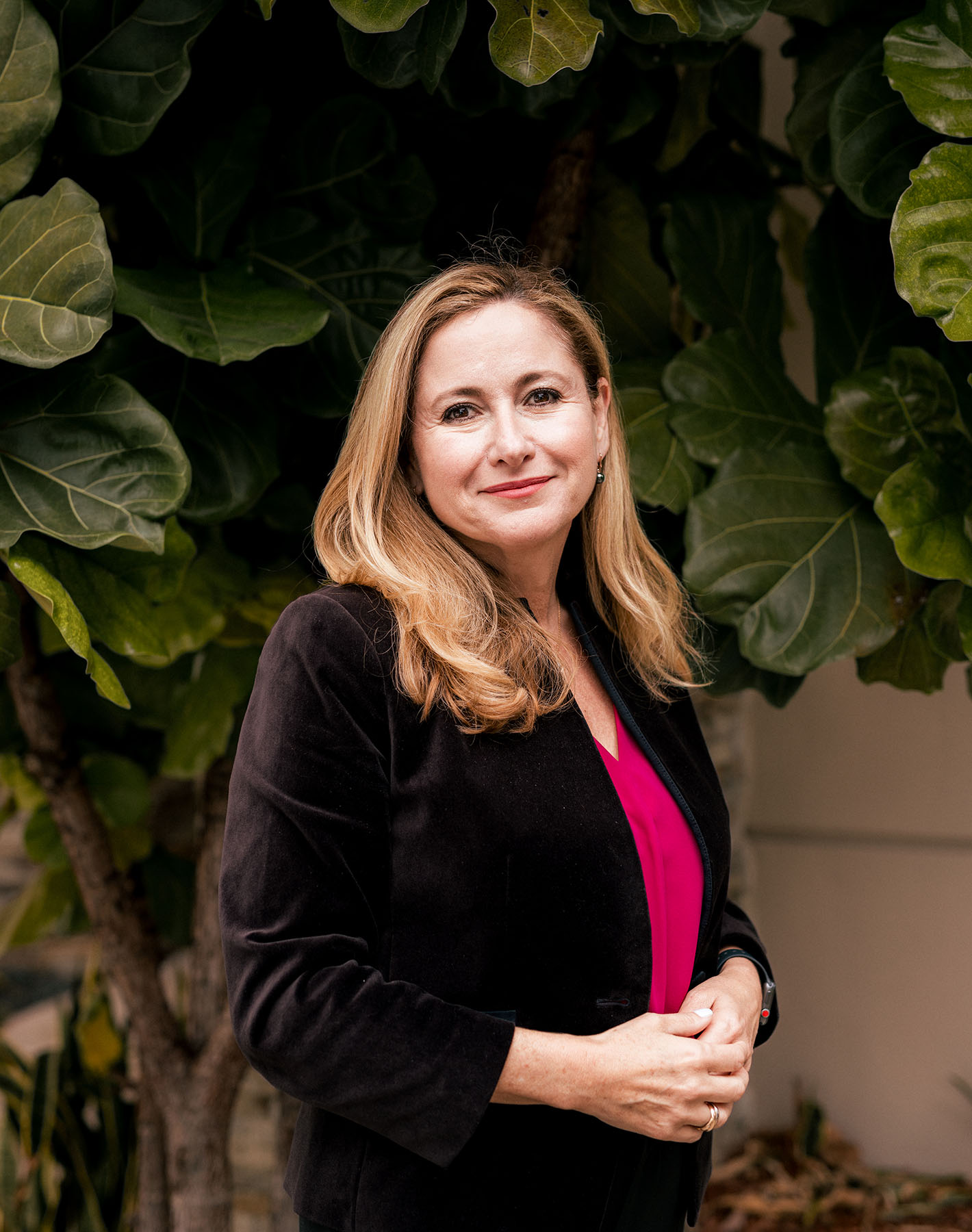 Debbie-Mucarsel-Powell poses for a portrait near a large tree.