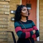 Diane Lewis stands for a portrait on the steps of the apartment building where she grew up in the Upper Albany area of Hartford, Connecticut.