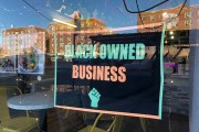 A black poster, reading 