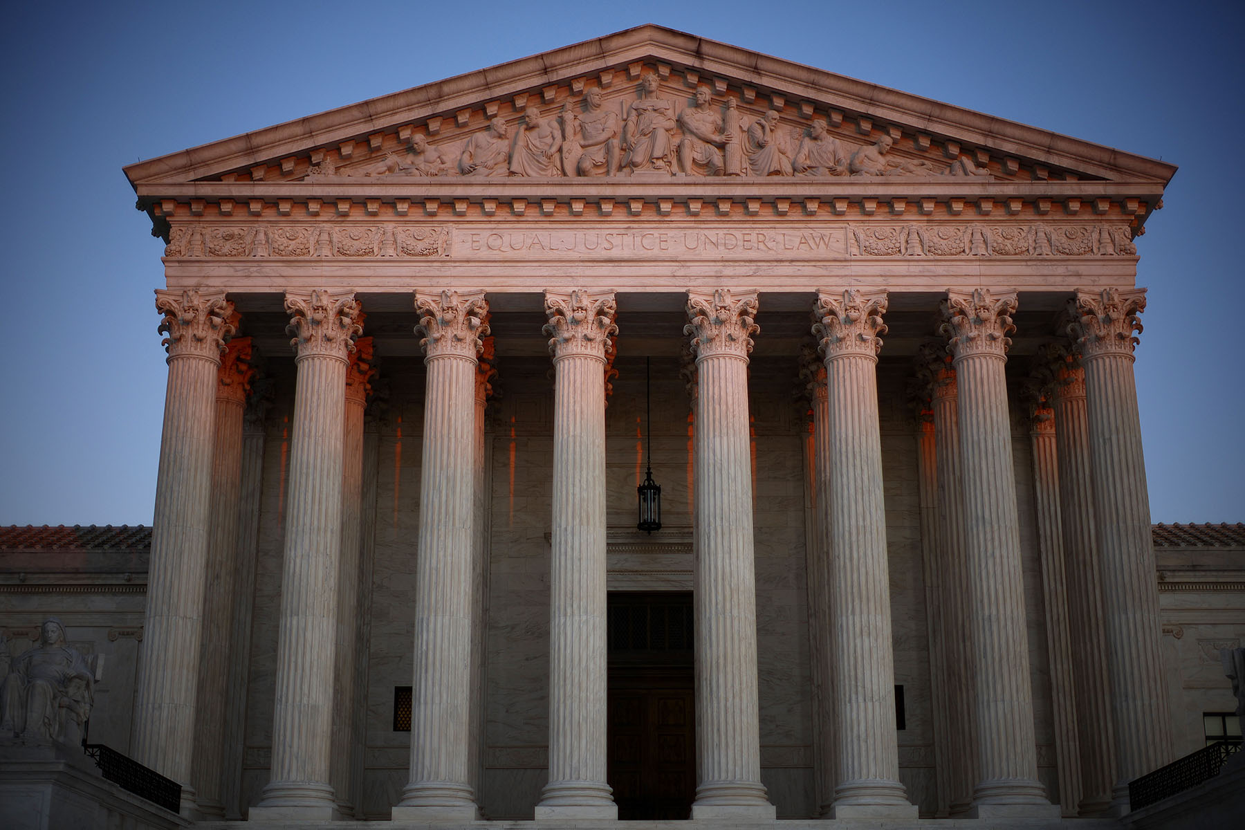 The U.S. Supreme Court is seen at dawn.