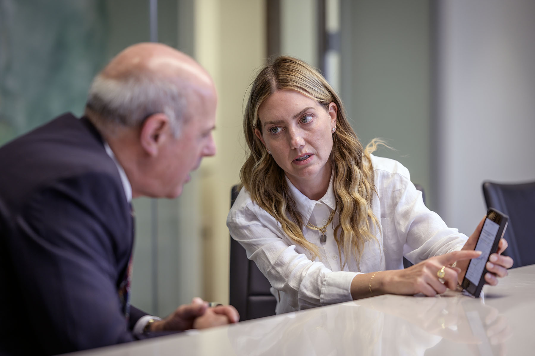 Melissa Alexander meets with state Rep. Gino Bulso in his law offices.