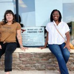 Gwen Frisbie-Fulton (left) and Taí Coates-Wedde pose for a photo outside Down Home N.C.'s office.