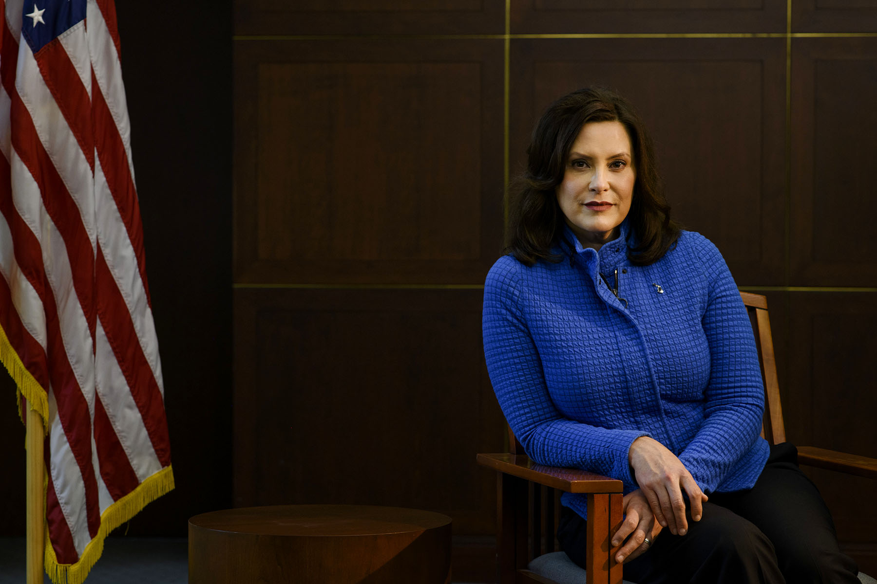 Gretchen Whitmer looks at the camera and smiles as she poses for a portrait.