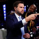 Sen. JD Vance prepares to give an interview to Fox News on the first day of the Republican National Convention.