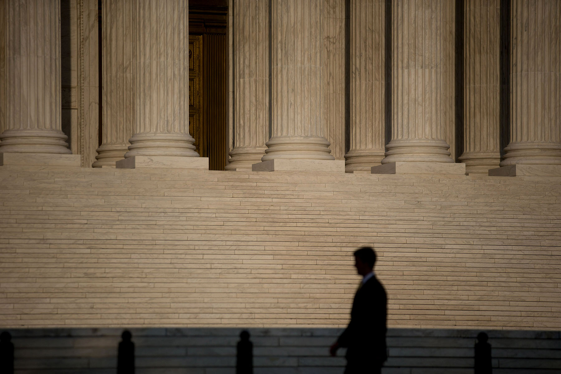 A man walks past the U.S. Supreme Court in Washington, D.C.