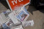 Newspapers lay on the ground in Milwaukee, Wisconsin. The front page of USA Today is seen with a photo of Trump being escorted off stage after an assassination attemp with the headline 