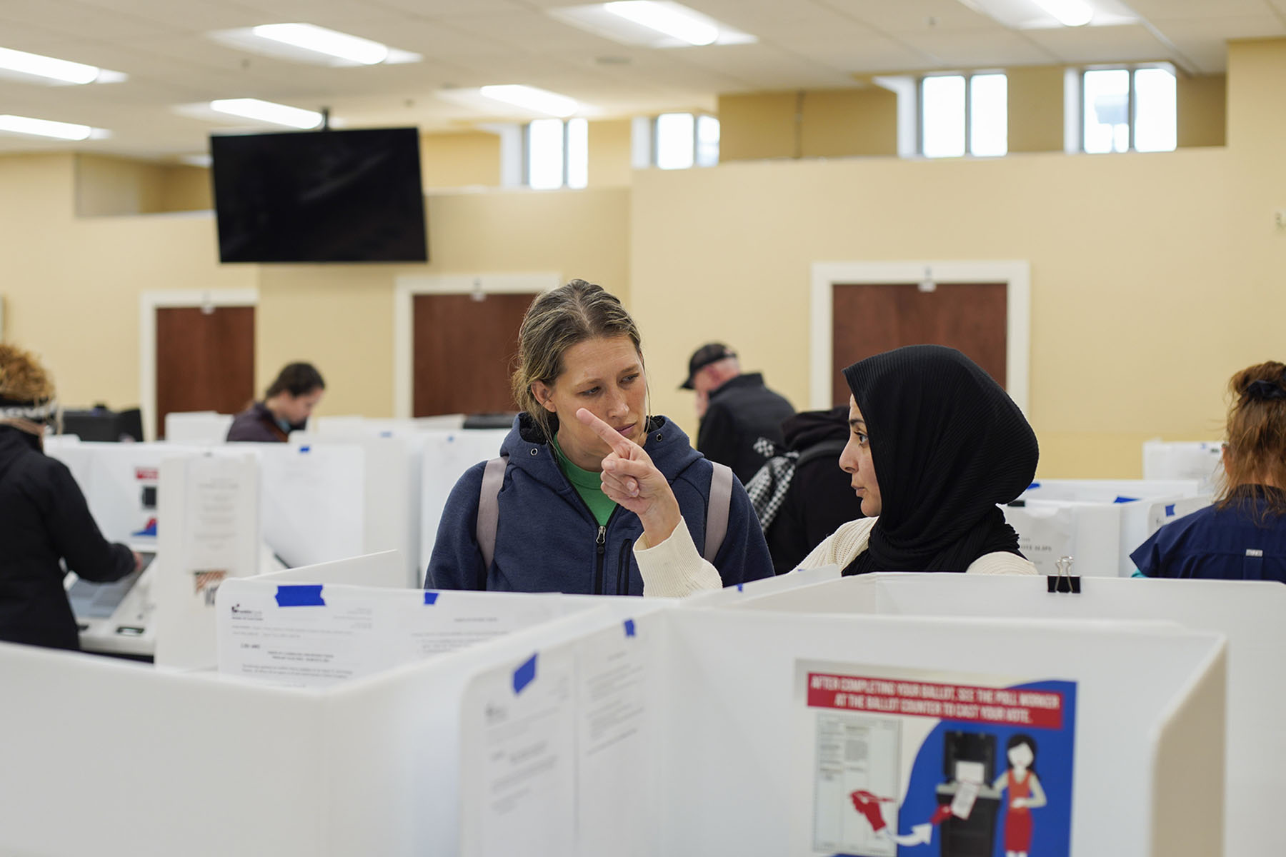 A poll worker helps a voter in Columbus, Ohio.