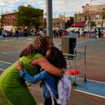 A first grader receives a hug outside of P.S. 503 in Brooklyn, New York, on the first day of school.