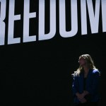 Abortion rights activist Hadley Duvall waits to speak on the first day of the Democratic National Convention.