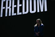 Abortion rights activist Hadley Duvall waits to speak on the first day of the Democratic National Convention.