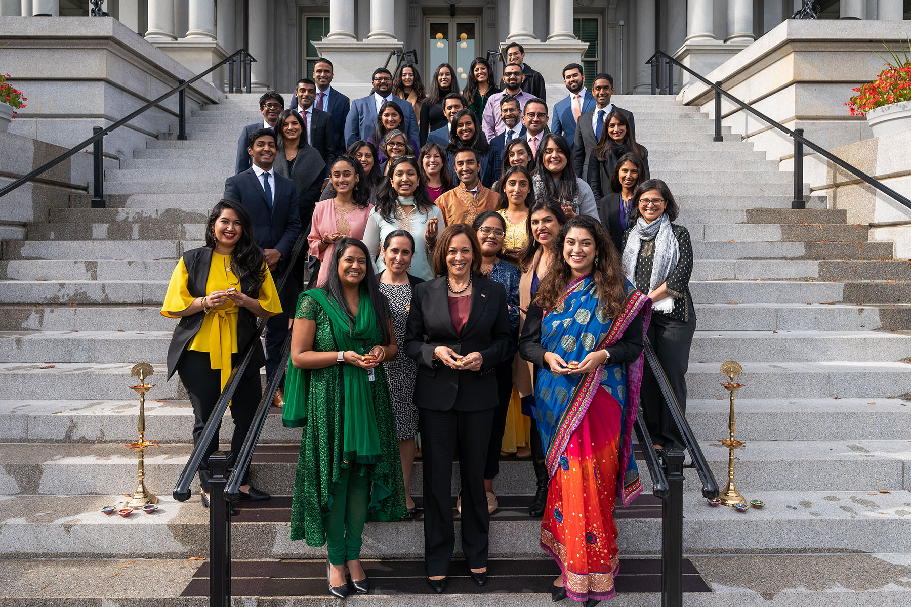 Vice President Kamala Harris, joined by White House staff, poses for a group photo in celebration of Diwali.