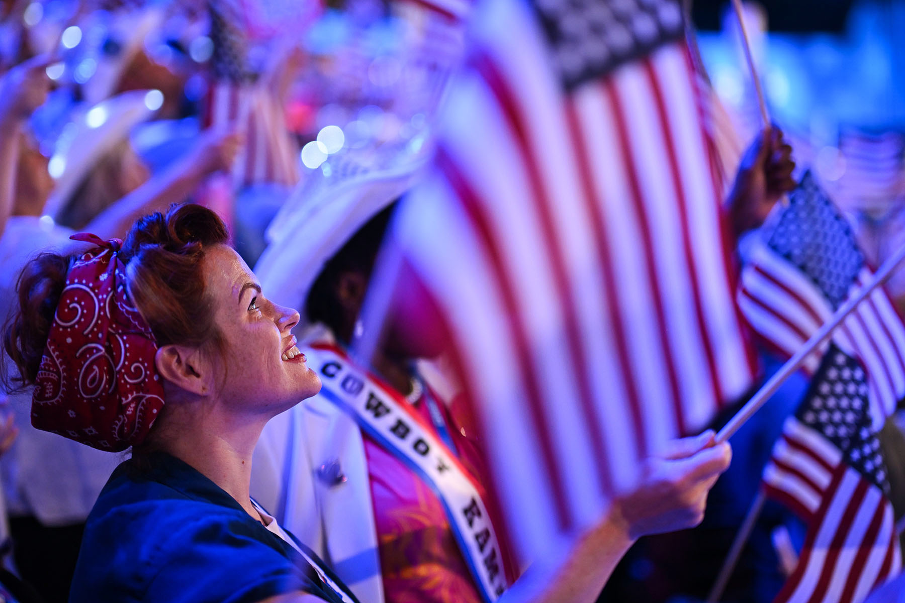 Attendees wave American flags during the final day of the DNC.