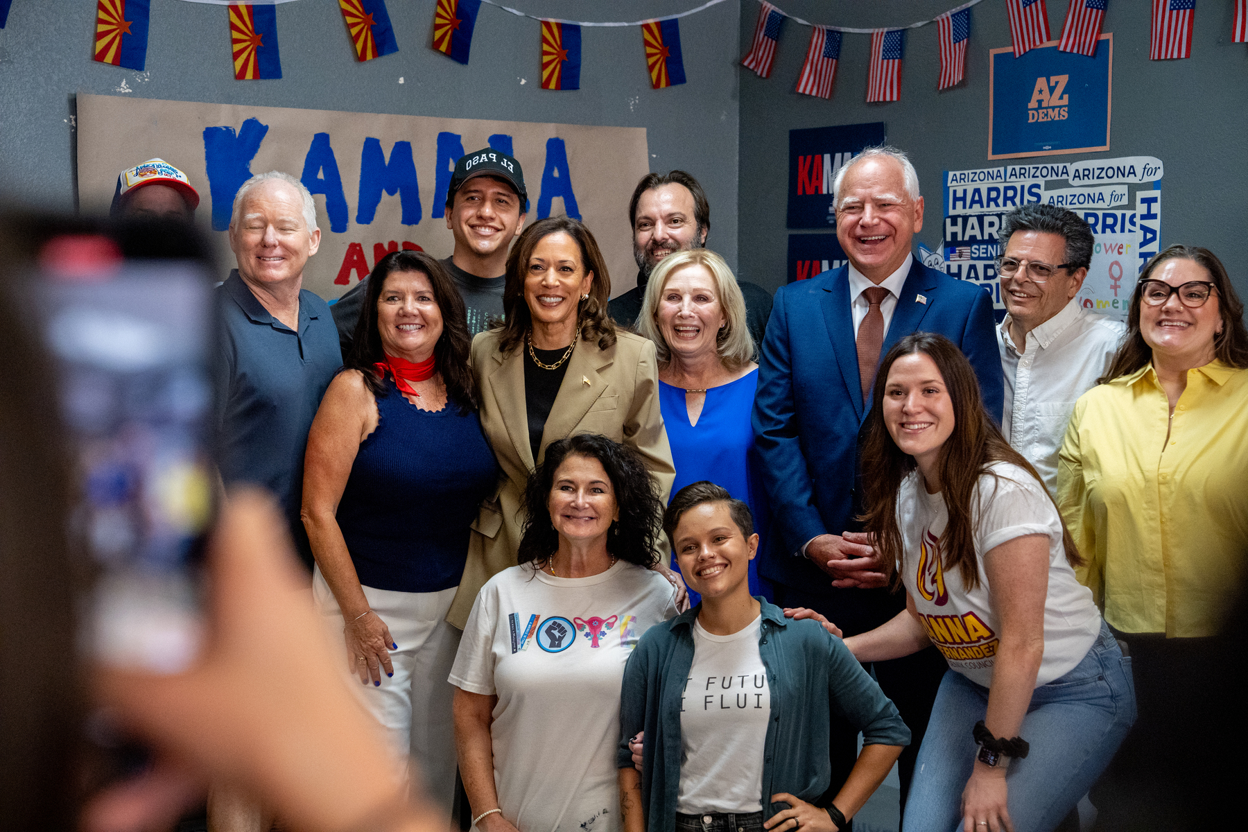 Democratic presidential candidate, U.S. Vice President Kamala Harris and Democratic vice presidential candidate Minnesota Governor Tim Walz take a photograph with supporters during a campaign visit.