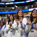 Delegates from New York applaud during the final day of the Democratic National Convention.