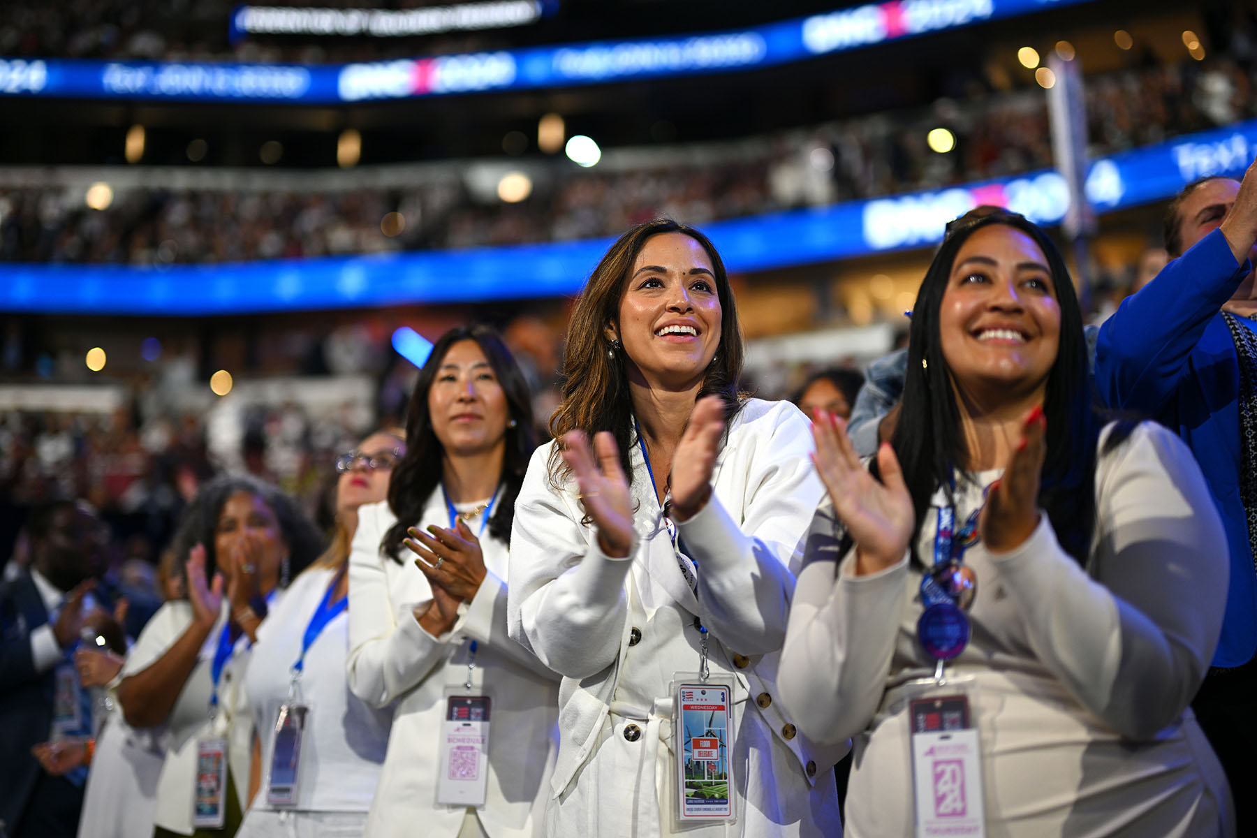 Delegates from New York applaud during the final day of the Democratic National Convention.