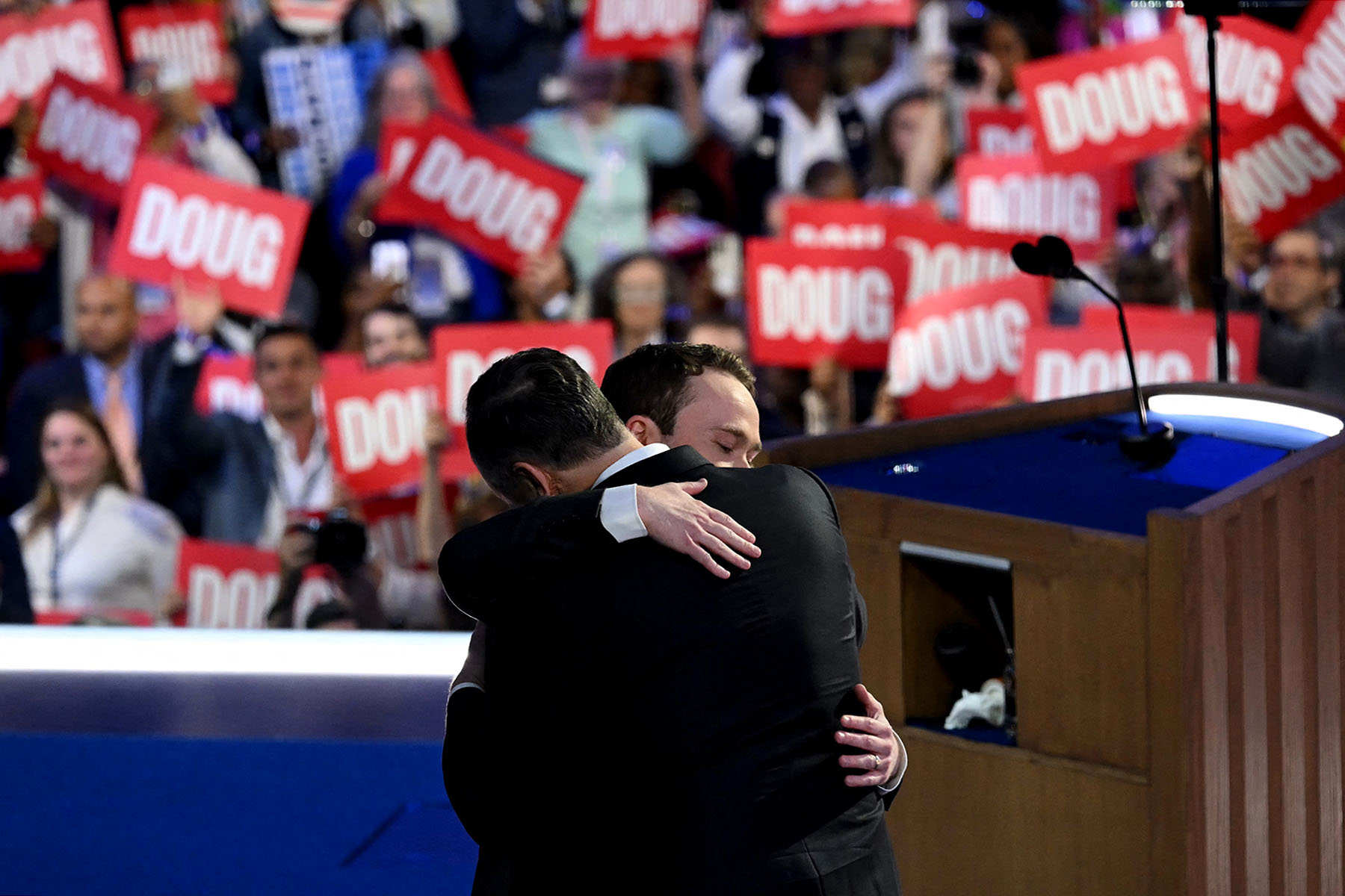 Douglas Emhoff hugs his son Cole Emhoff on the second day of the DNC.