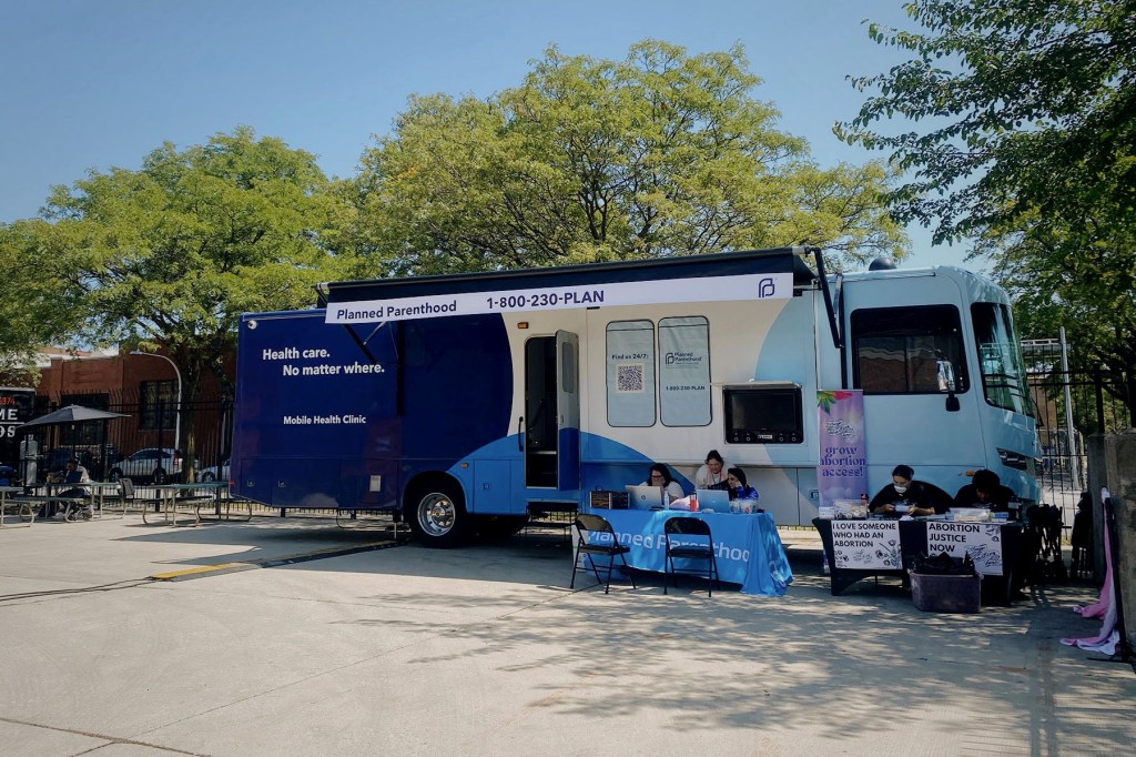 A pop-up mobile health clinic is parked in downtown Chicago