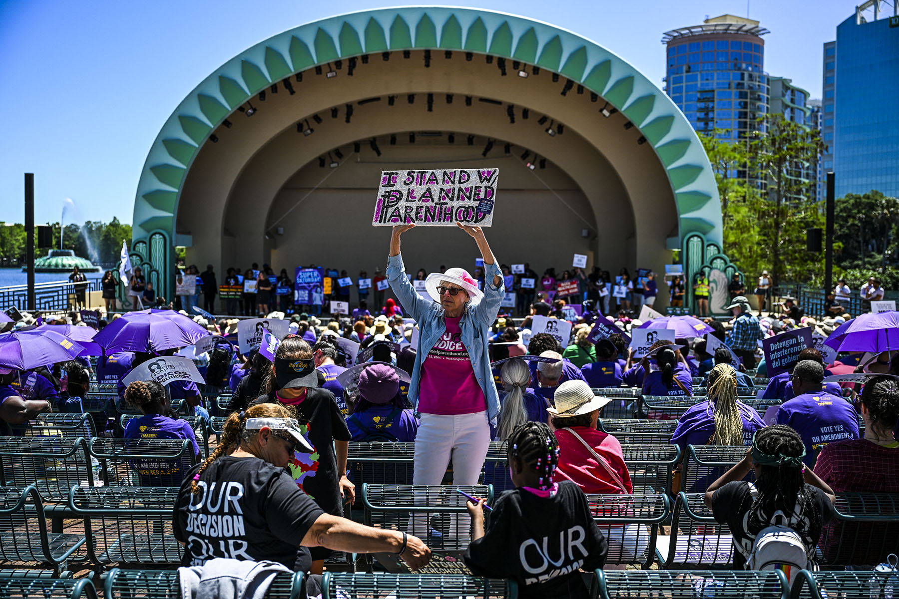 A woman holds a sign that reads "I stand w/ Planned Parenthood" as Abortion rights activists participate in a rally to protect abortion rights for Floridians.