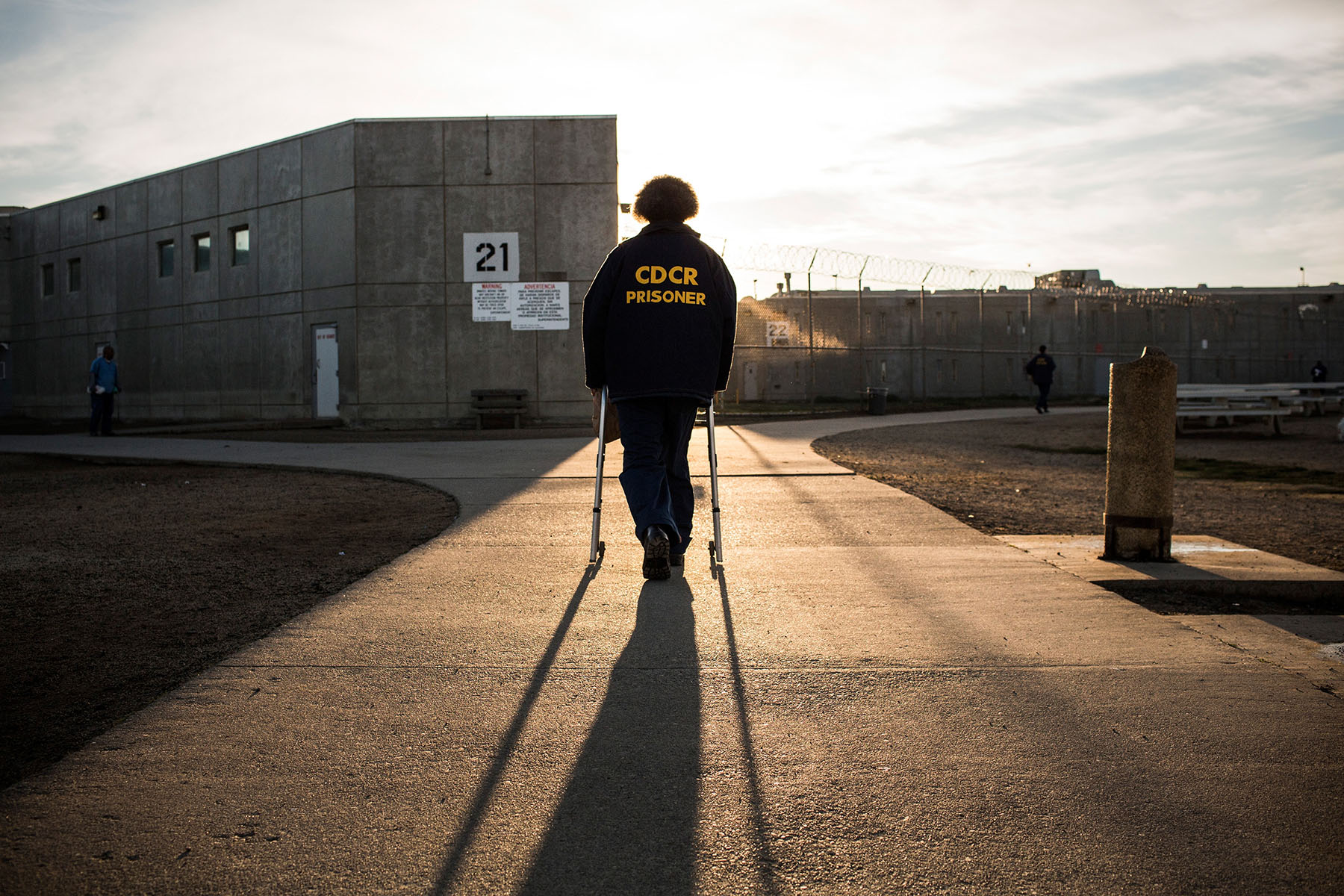 A prisoner walks back to his cell block at a California State Prison in Vacaville, California, in December 2013.