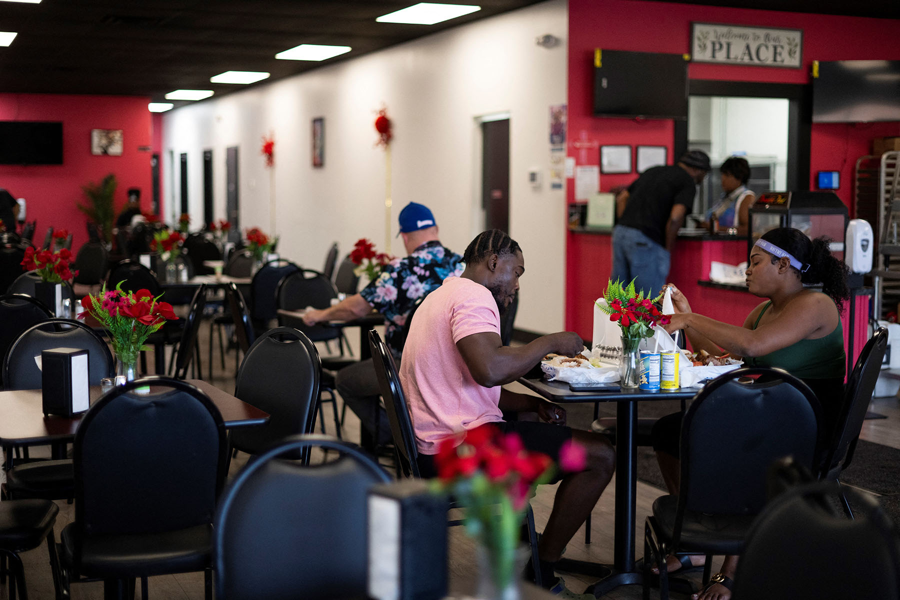 Community members eat at a Haitian restaurant in Springfield, Ohio.