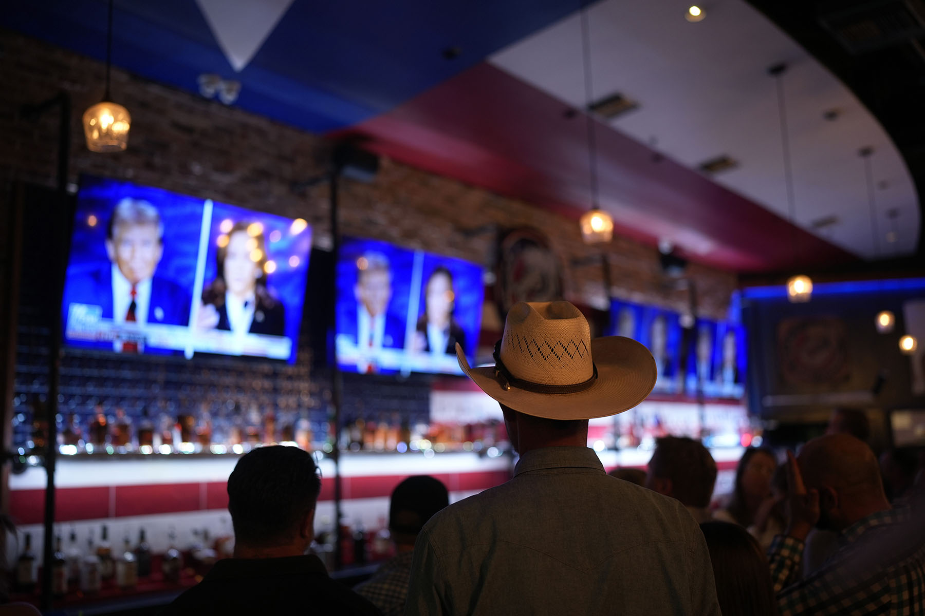 Viewers gather to watch the debate between Vice President Kamala Harris and former President Donald Trump at the Angry Elephant Bar and Grill in San Antonio, Texas.