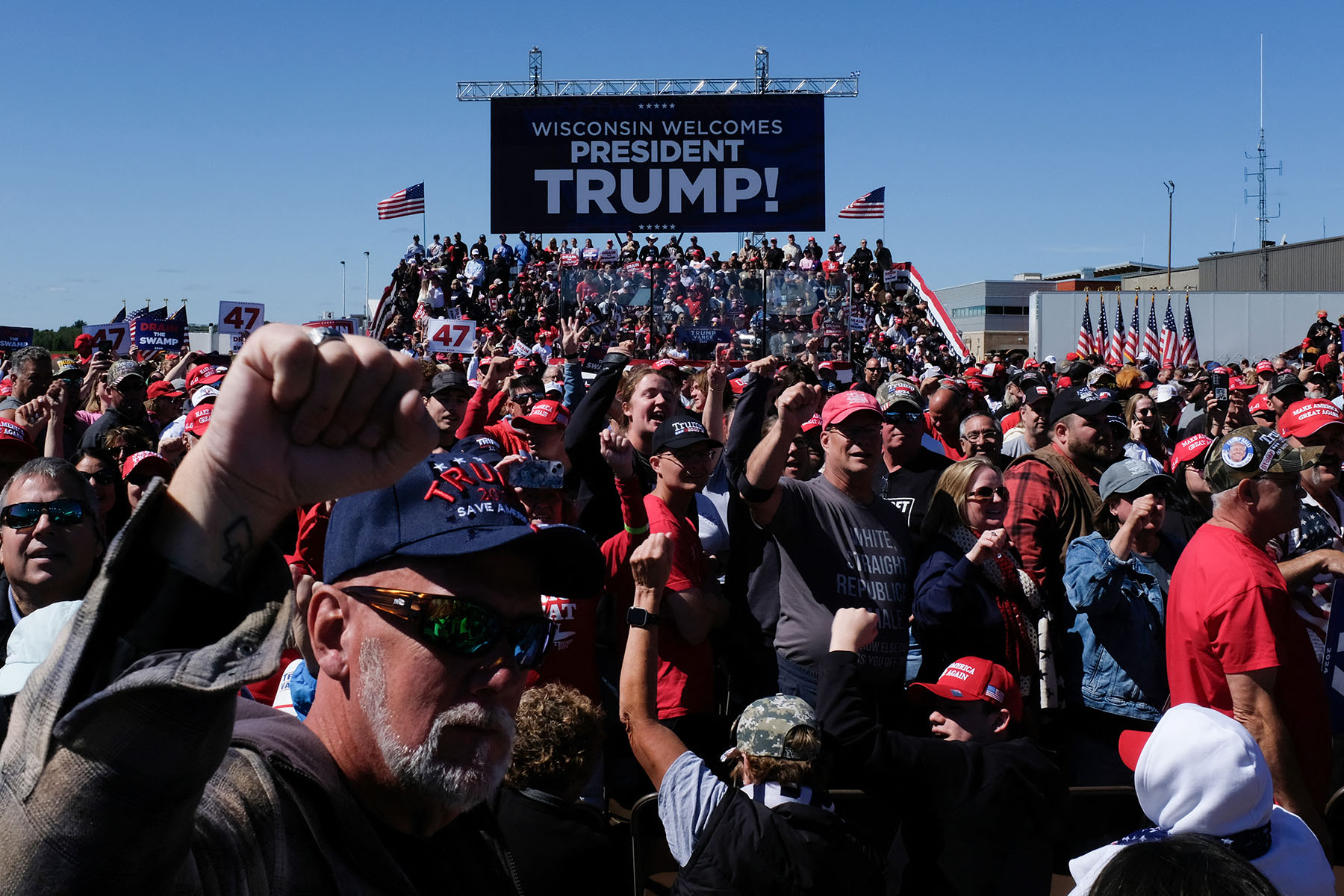 Supporters cheer as they wait for former President Trump at a campaign rally in Mosinee, Wisconsin.