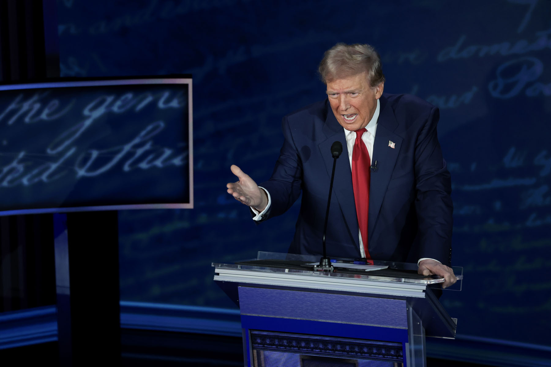 Former President Trump gestures as he debates Vice President Kamala Harris.