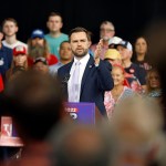 Sen. JD Vance speaks at a podium at a campaign event in Raleigh, North Carolina.