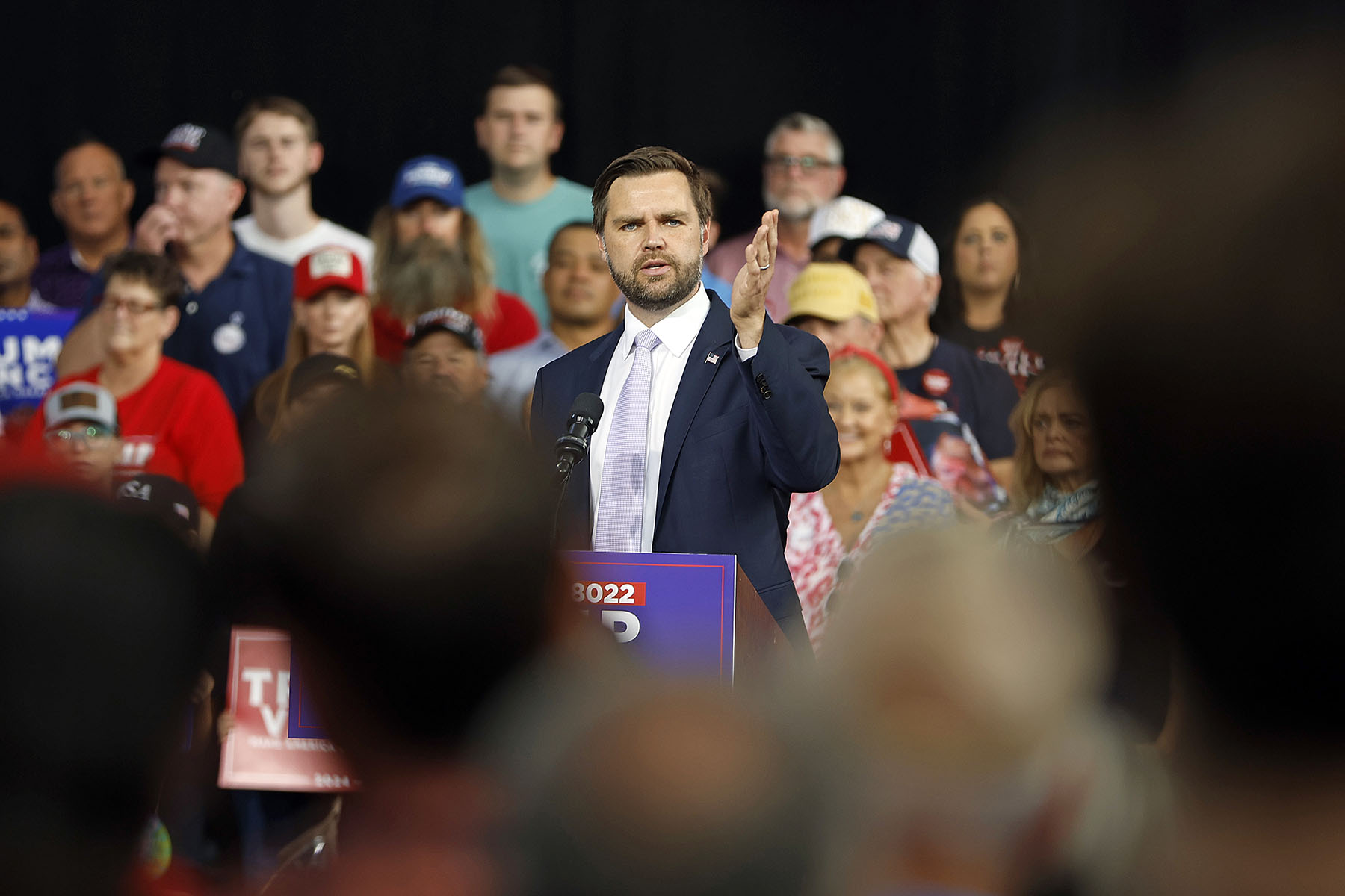 Sen. JD Vance speaks at a podium at a campaign event in Raleigh, North Carolina.