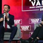 Sen. JD Vance sits on stage to be interviewed